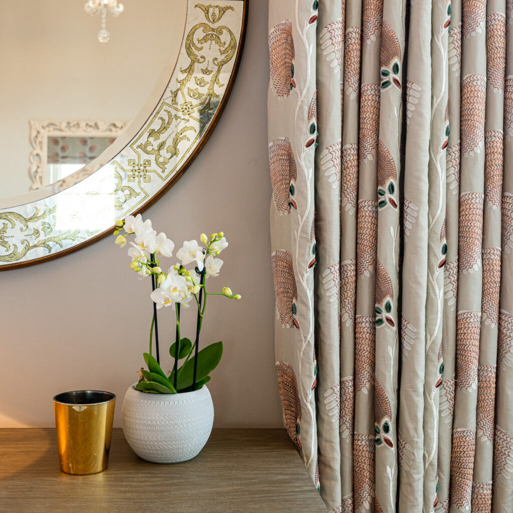 Orchid, mirror and curtains
